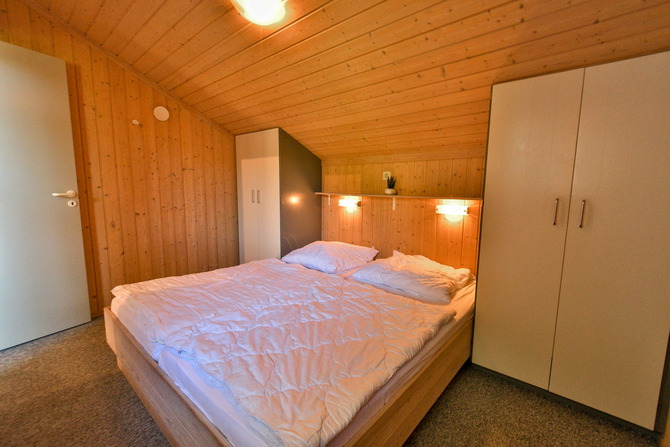 Ferienhaus in Pelzerhaken - Am Waldrand Haus C - Schlafzimmer mit Doppelbett